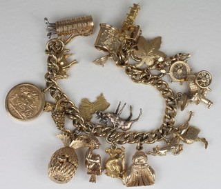 A gold curb link charm bracelet, hung an Edward VIII 1907 half sovereign and 17 various other charms  ILLUSTRATED