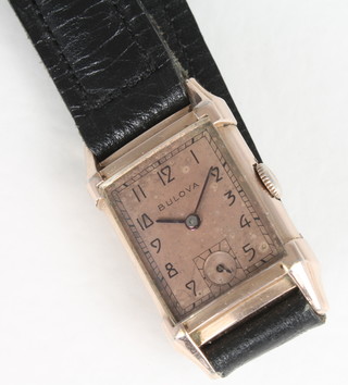 A gentleman's Bulova wristwatch contained in a gilt metal case