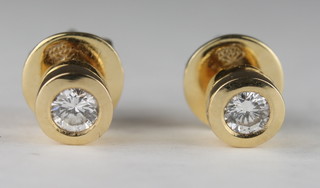 A pair of 18ct yellow gold ear studs