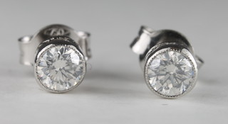 A pair of diamond set ear studs, approx 0.43ct