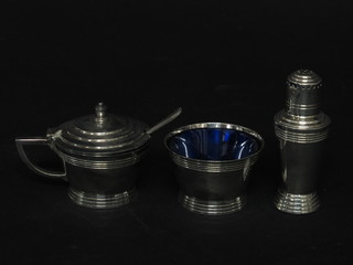 An Art Deco silver plated 3 piece condiment set by Mappin &  Webb comprising salt pepper and mustard pot