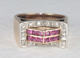 A gold dress ring set rubies and diamonds