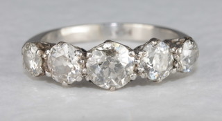 A platinum dress/engagement ring set 5 diamonds  ILLUSTRATED