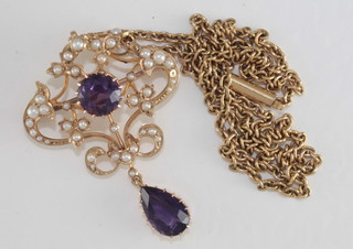 A handsome Edwardian 15ct gold pendant/brooch set amethysts  and demi-pearls hung on a fine gold chain