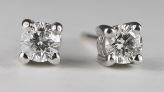 A pair of claw set diamond ear studs, approx 0.36ct