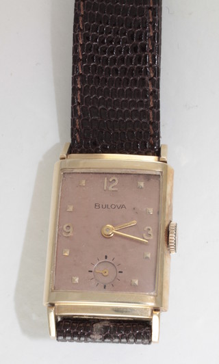 A gentleman's Bulova wristwatch contained in a 14ct gold case