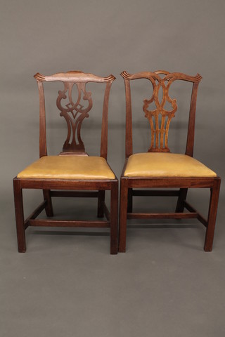 A matched pair of Chippendale style mahogany slat back dining  chairs with upholstered drop in seats, raised on square tapering  supports