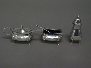 A silver 3 piece condiment set comprising mustard, salt and pepper pot, Birmingham 1936, 3 ozs