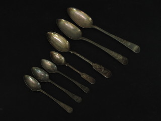 2 Georgian Old English silver pattern table spoons, 3 Georgian  Old English pattern silver tea spoons, a Victorian silver fiddle  patterned pudding spoon and do. teaspoon, 8 ozs