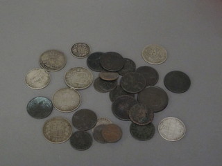 A collection of various silver and copper coins