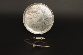 A circular silver plated tray with gallery border, an Admiralty issue bosuns call and an Acme Scout Master's whistle