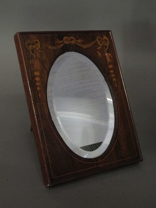 A Victorian oval bevelled plate mirror contained in a rosewood easel frame 8"