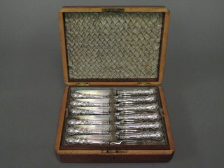 A set of 24 Victorian silver fruit knives and forks with silver blades and handles, Birmingham 1878, contained in a walnut  canteen box