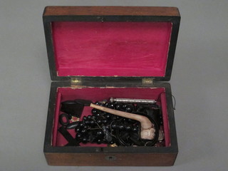 A walnut trinket box containing costume jewellery