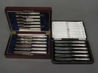 A set of 6 fruit knives and forks with mother of pearl handles and  a set of 6 tea knives, cased