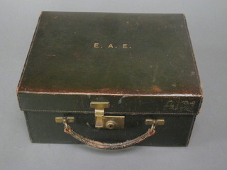 A green leather vanity case by Mappin & Webb containing some contents