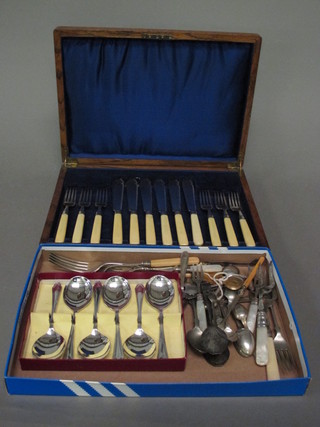 A set of 6 silver plated fish knives and forks in an oak canteen  box and a collection of flatware