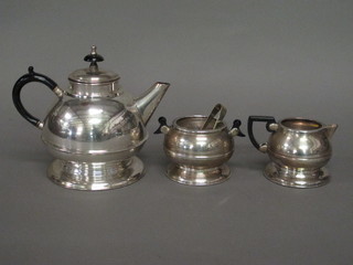 A circular silver plated 3 piece tea service