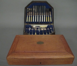 2 oak canteen boxes containing a collection of flatware