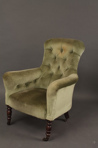 A Victorian mahogany tub back chair upholstered in green  buttoned material, raised on cabriole supports