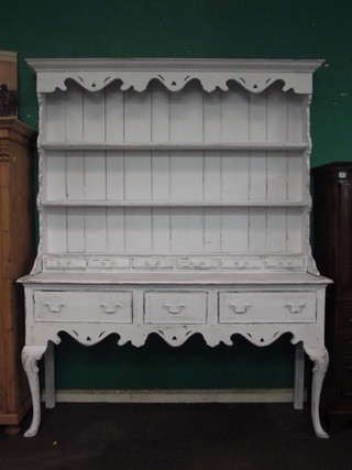 A white painted dresser, the raised back with pierced and  moulded cornice fitted 3 shelves above 6 shallow drawers, the  base fitted 3 drawers, raised on cabriole supports 67"