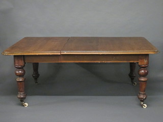 A Victorian mahogany extending dining table with 1 extra leaf, raised on turned supports 73"