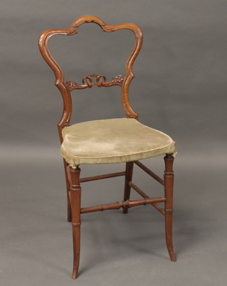 A Victorian mahogany spoon back bedroom chair with pierced  mid rail and upholstered seat, raised on turned supports