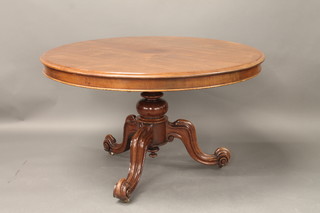 A Victorian circular snap top mahogany breakfast table raised on  a bulbous turned and tripod support 47"