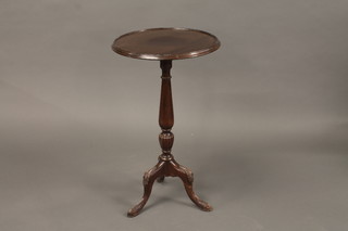 An Edwardian circular mahogany wine table, raised on pillar and tripod base 16"