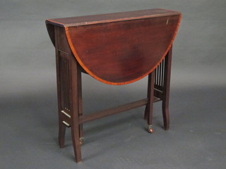 An Edwardian oval inlaid mahogany Sutherland table