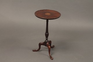 An Edwardian circular inlaid mahogany wine table, raised on a pillar and tripod base 11"