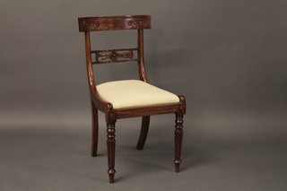 A William IV mahogany bar back dining chair with pierced mid  rail raised on turned and fluted supports