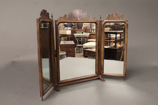 A Chippendale style triple plate dressing table mirror contained in a walnut frame