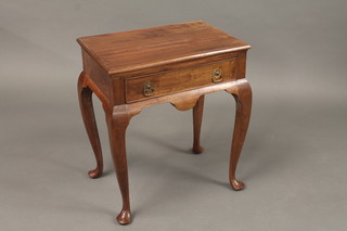 A Georgian style rectangular mahogany lamp table fitted a drawer and raised on cabriole supports 20"