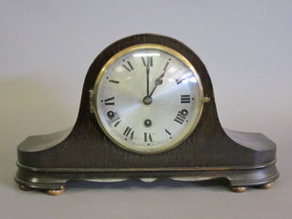 A 1930's chiming mantel clock with silvered dial and Arabic  numerals contained in a mahogany Admiral's hat shaped case