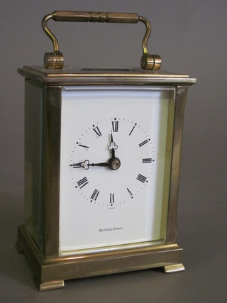 A 20th Century English carriage clock with enamelled dial and Roman numerals marked Shortland Bowen