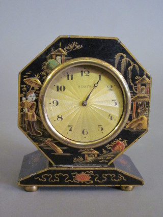 An Art Deco 8 day bedroom timepiece with gilt dial contained in an octagonal black chinoiserie lacquered case