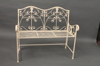 A white painted metal slatted and folding garden bench 41"