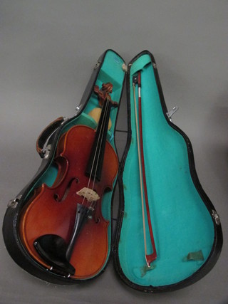 A Lark violin complete with fibre carrying case