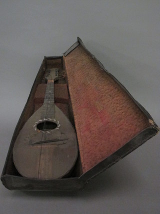 A mandolin marked F Demureda Naples, cracked and requires  some attention,