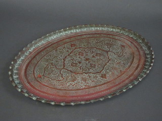 An oval Eastern embossed copper tray 27"