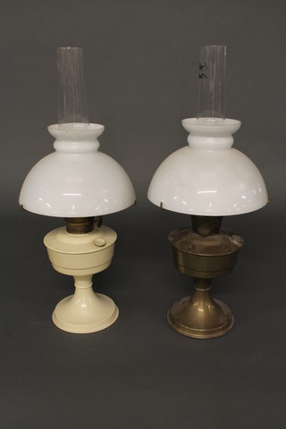 A white painted Aladdin oil lamp complete with chimney and  shade and 1 other