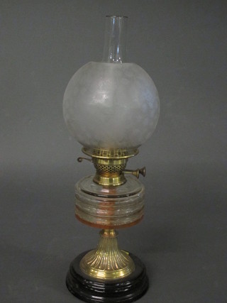 A Victorian glass oil lamp, the reservoir with etched glass shade