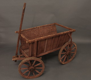 A painted rectangular wooden cart with iron shod wheels 36"