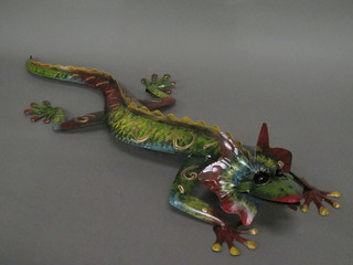 A pressed and pierced metal model of a Geko 34"