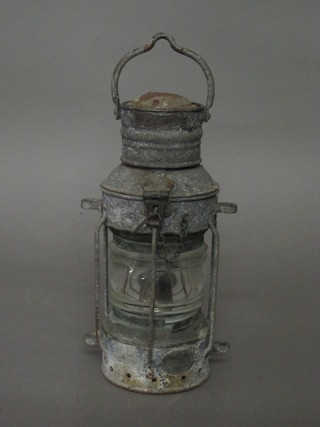 A cylindrical ships lantern marked Anchor