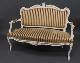 A white painted Edwardian open arm salon sofa upholstered in yellow striped material, raised on cabriole supports 48"