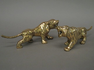 A pair of brass figures of walking tigers 11"
