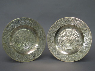 A pair of Oriental gilt bronze chargers decorated figures, the reverse with seal mark 10"