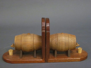 A pair of wooden book ends in the form of a barrels